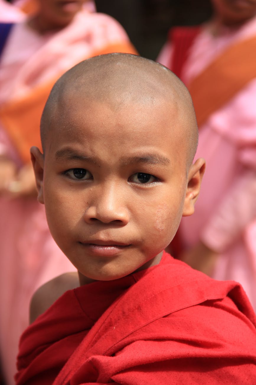 A young child in traditional attire, representing the Rohingya community whose language and culture are at the brink of being forgotten.