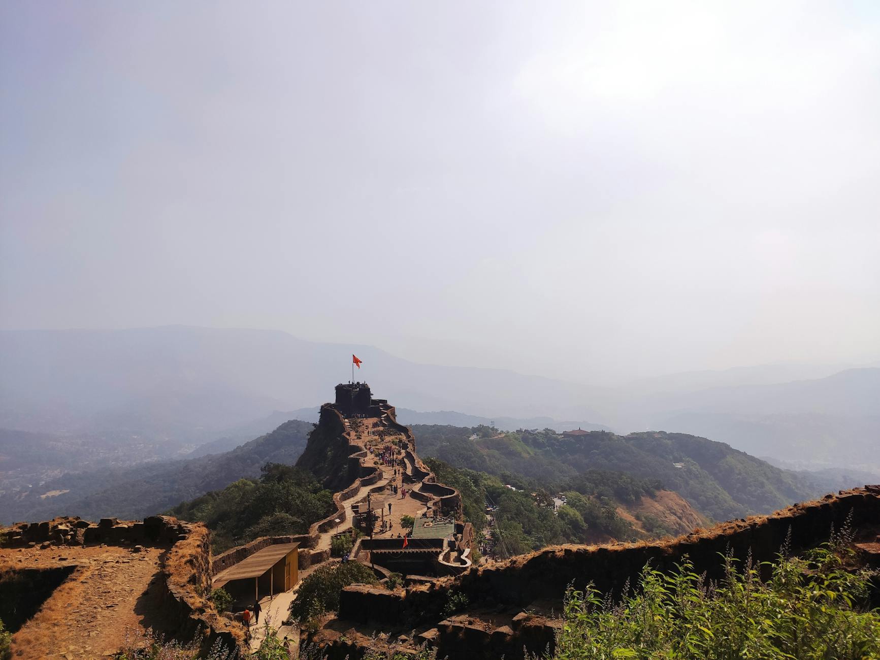 The majestic Pratapgad Fort in Maharashtra, India, standing atop a mountain, symbolizing the historical richness that Marathi to English language translation helps share globally.