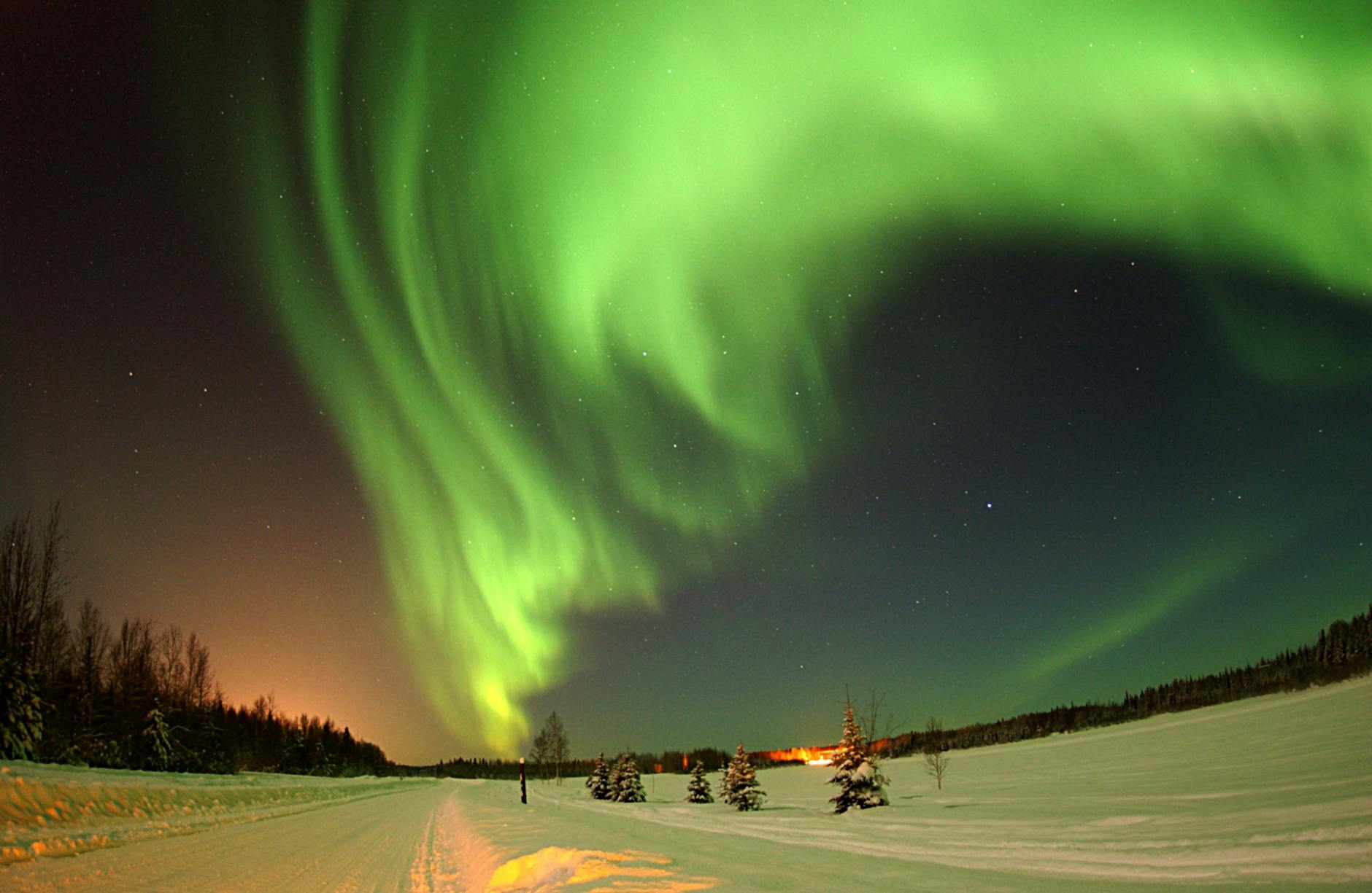 pectacular view of the Northern Lights in Alaska, capturing the natural beauty of the region where the Yupik language translator app helps bridge communication gaps.
