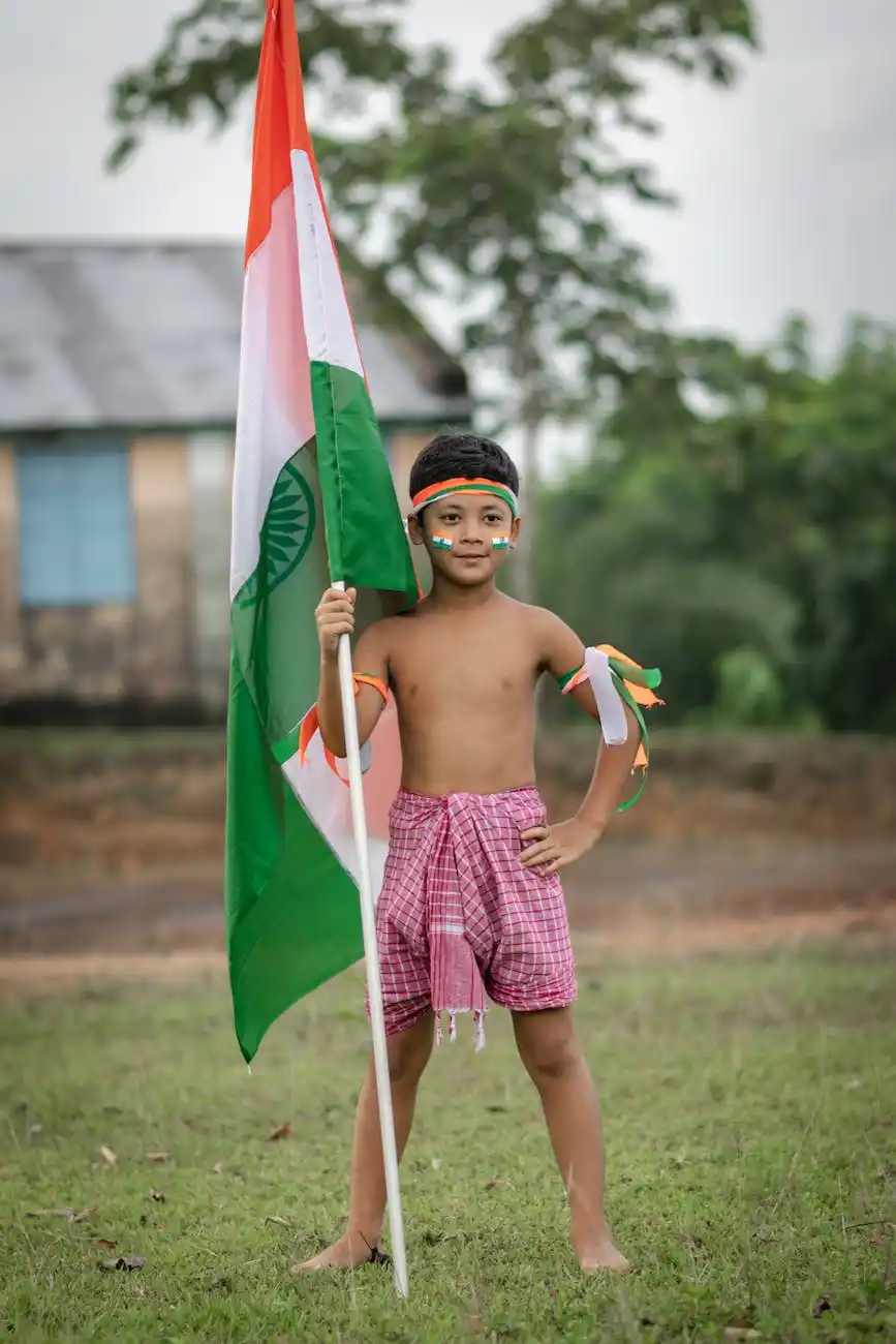 A young boy stands proudly with the Indian flag, reflecting the vibrant spirit of the Telugu-speaking community and the importance of Telugu translators in preserving cultural identity.