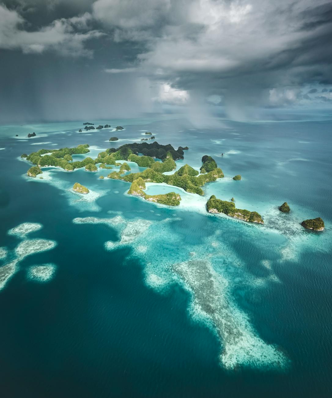Scenic view of Palau Islands with turquoise waters and lush greenery, representing the origins of the Carolinian language.