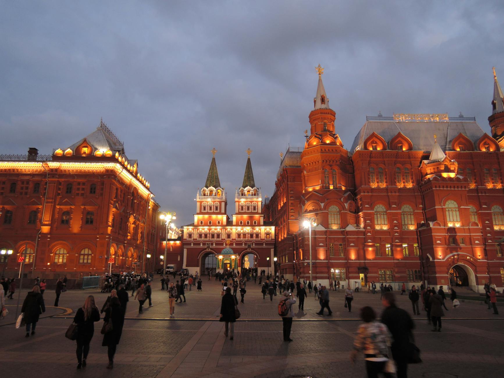A bustling square in Moscow, Russia, with illuminated historic buildings, highlighting the cultural context of the Tatar language.